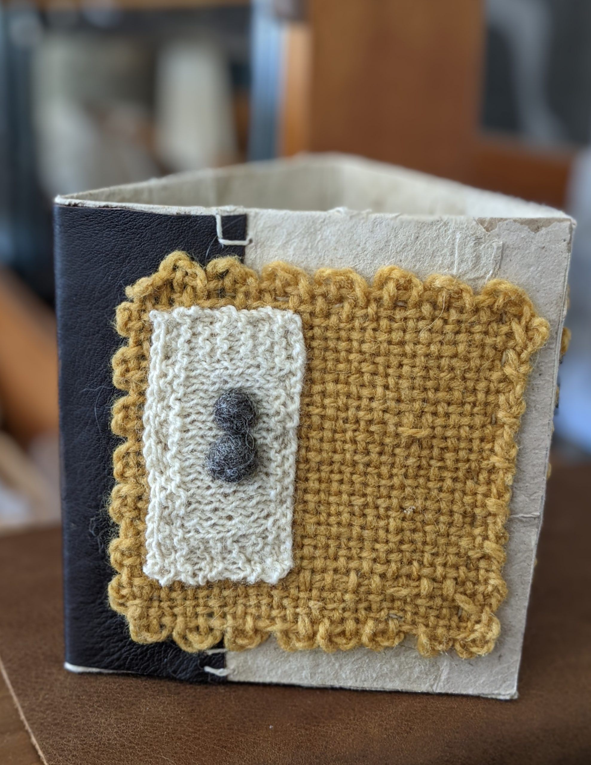 Image is of a blue book with hand-sewn linen binding.